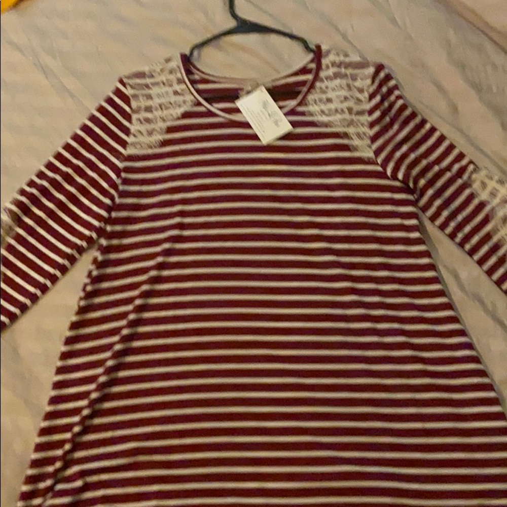 Red and white striped top with lace accent.